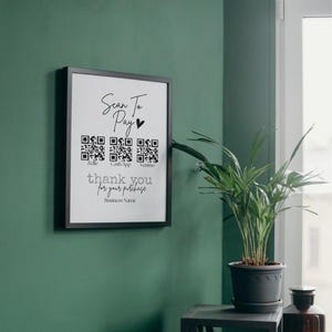 May include: A black framed sign with the text "Scan to Pay" and a heart symbol. There are three QR codes labeled "Zelle", "Cash App", and "Venmo". The sign also says "thank you for your purchase" and "Business Name".