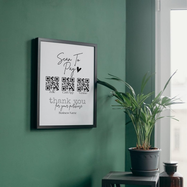 May include: A black framed sign with the text "Scan to Pay" and a heart symbol. There are three QR codes labeled "Zelle", "Cash App", and "Venmo". The sign also says "thank you for your purchase" and "Business Name".