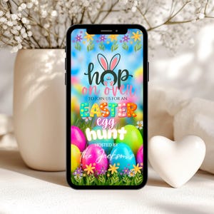 May include: A smartphone displays an Easter egg hunt invitation. The invitation features colorful eggs, floral accents, and the text "Hop on over to join us for an Easter egg hunt, hosted by the Jacksons."