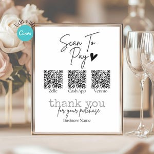 May include: White sign with black text that reads "Scan To Pay" with a heart symbol. There are three QR codes labeled "Zelle", "Cash App", and "Venmo". The sign also says "thank you for your purchase" and "Business Name".