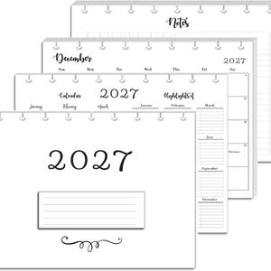May include: A white 2027 planner with disc-bound pages. The cover features the year 2027, a lined rectangular box, and a decorative flourish. Interior pages show a monthly calendar for December 2027, a yearly overview, and a notes section with lines.