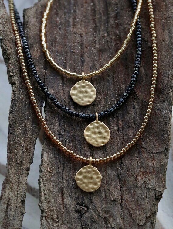 Gold hammered round disc beaded necklace