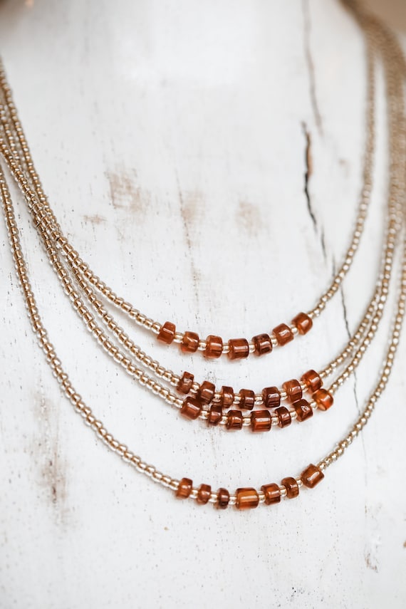 Hessonite garnets and glass bead necklace