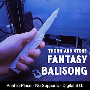 May include: A white 3D-printed balisong knife with a textured handle and blade. The text on the image reads: THORN AND STONE FANTASY BALISONG. Print in Place - No Supports - Digital STL. The object is held in a hand against a dark background.