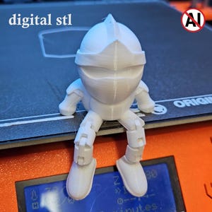 May include: A white 3D printed figurine of a knight with a rounded helmet and articulated limbs, sitting on a printer bed. The text "digital stl" is visible in the upper left corner, and a circular "AI" symbol with a red slash is in the upper right.