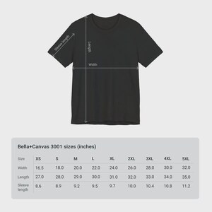 May include: Black t-shirt with size chart. The chart shows Bella+Canvas 3001 sizes in inches, including width, length, and sleeve length for sizes XS to 5XL. The t-shirt has a crew neck and short sleeves.