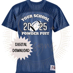 May include: Navy blue mesh jersey with white text that reads "YOUR SCHOOL 2025 POWDER PUFF" and a football graphic. A digital download graphic is in the lower left corner. The jersey has a tag in the lower right corner.