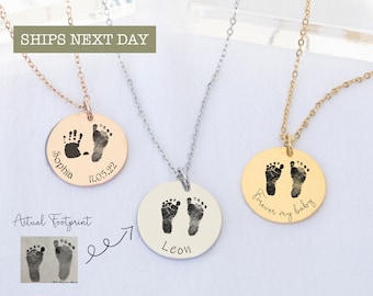 May include: Three silver necklaces with round pendants featuring engraved footprints and names. The pendants are engraved with the names "Sophia", "Leon", and "forever my baby".