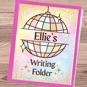 May include: A pink writing folder with a disco ball design. The folder has the text "Ellie's Writing Folder" in a playful font. The background is a mix of pastel colors with gold glitter accents.