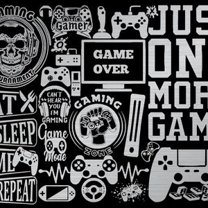 May include: Black graphic design featuring gaming-related elements. Includes text like "GAME OVER", "JUST ONE MORE GAME", and "EAT SLEEP GAME REPEAT". Various game controllers and a skull with headphones are also present.