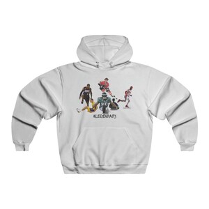May include: White hooded sweatshirt with a graphic print of five athletes in different sports. The athletes are wearing their team uniforms. The text '#LEGENDARY' is printed below the graphic.