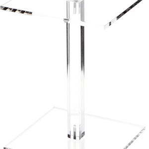 May include: A clear acrylic display stand with a square base and a smaller square top. The stand has a central rectangular support column. The edges of the squares have a slight beveled detail. The stand is designed to showcase items.