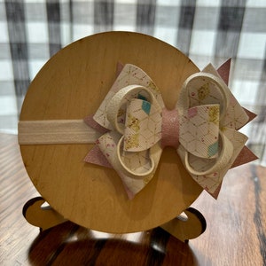 Faux leather baby headband. Colorful bow with white elastic band for baby.