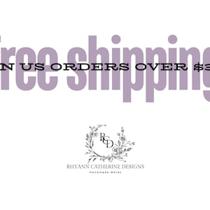 Puede incluir: Texto morado sobre fondo blanco que dice "free shipping on US orders over $35". Debajo del texto hay una corona floral en blanco y negro con las letras "RCD" en el centro. Debajo de la corona est&aacute; el texto "Rhyann Catherine Designs Handmade Wares".