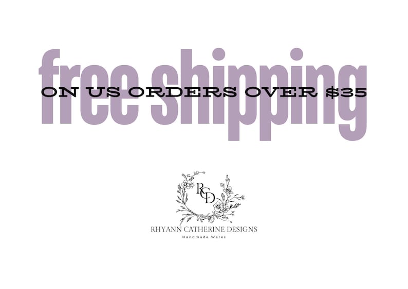 Puede incluir: Texto morado sobre fondo blanco que dice "free shipping on US orders over $35". Debajo del texto hay una corona floral en blanco y negro con las letras "RCD" en el centro. Debajo de la corona est&aacute; el texto "Rhyann Catherine Designs Handmade Wares".