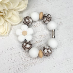 Bedel madeliefluipaard: bekerhandvat, tasaccessoire