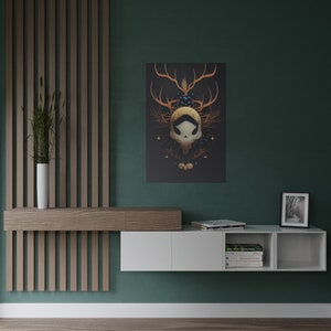 May include: A white floating shelf unit with two open shelves and a closed cabinet. The shelf unit is mounted on a green wall. The shelf unit is decorated with books, a framed photo, and a framed print of a skull with antlers and berries.