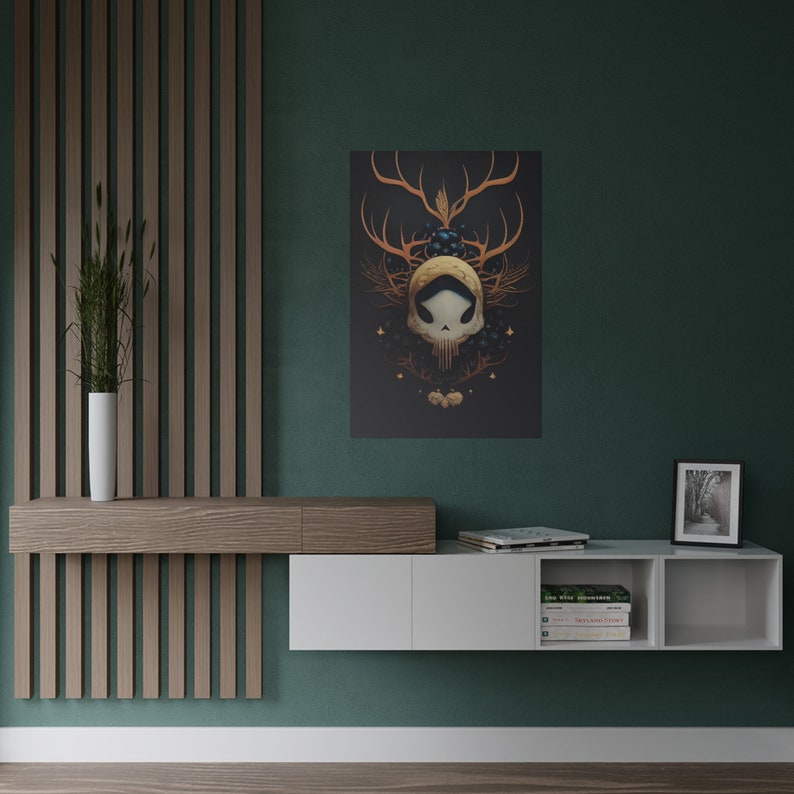 May include: A white floating shelf unit with two open shelves and a closed cabinet. The shelf unit is mounted on a green wall. The shelf unit is decorated with books, a framed photo, and a framed print of a skull with antlers and berries.