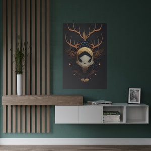 May include: A white floating shelf unit with two drawers and three open cubbies. The shelf is mounted on a green wall. The shelf is decorated with books, a framed photo, and a framed print of a skull with antlers.