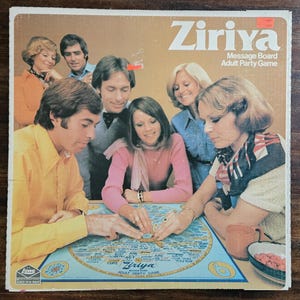 May include: A vintage Ziriya Adult Party Game box. The box has a brown background with the game title in white. The image shows a group of people around a blue game board with text and illustrations. The game is for ages 18 and up.