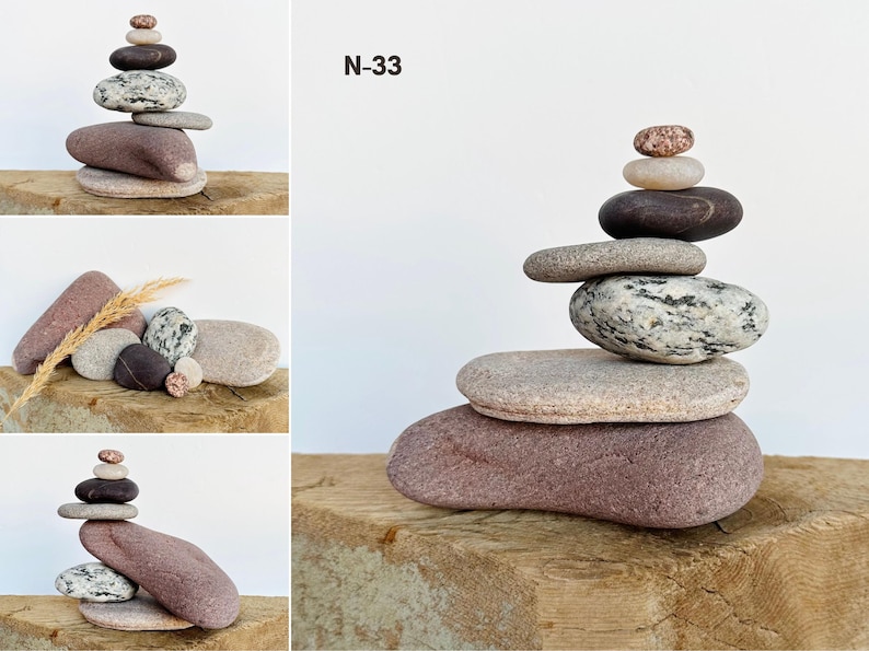 Puede incluir: Una escultura de piedra equilibrada hecha de varias piedras en tonos marrones, grises y rosados. Las piedras est&aacute;n apiladas unas sobre otras en una formaci&oacute;n precaria pero estable. La escultura est&aacute; sentada sobre una superficie de madera. N-33 est&aacute; escrito en la pared detr&aacute;s de la escultura.