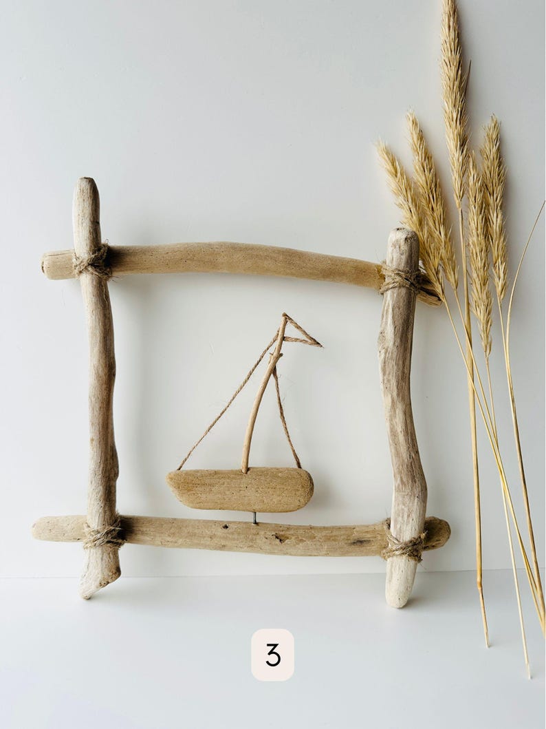 Natural driftwood wall decor with minimalist sailboat accent, rustic maritime wall hanging