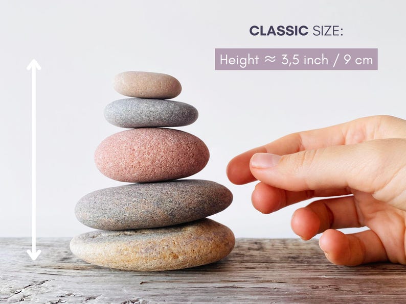 May include: A stack of five smooth, rounded river stones in varying shades of tan, gray, and pink. The stones are arranged vertically from largest at the base to smallest at the top. Text indicates a classic size with a height of 3.5 inches.