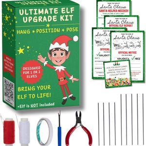 May include: A green box with the text "ULTIMATE ELF UPGRADE KIT" and an illustration of an elf. Includes accessories like thread, tape, a seam ripper, wire cutters, and report cards from Santa. The kit is designed for 1 or 2 elves.
