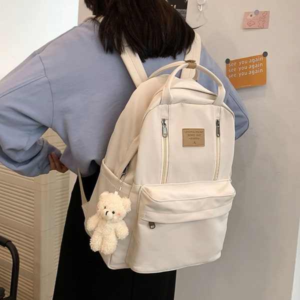 Nylon rugzak Basic Cute Bag Dagelijkse tas voor dames Grote capaciteit Reisschooltas Verstelbare riem met schattige pop