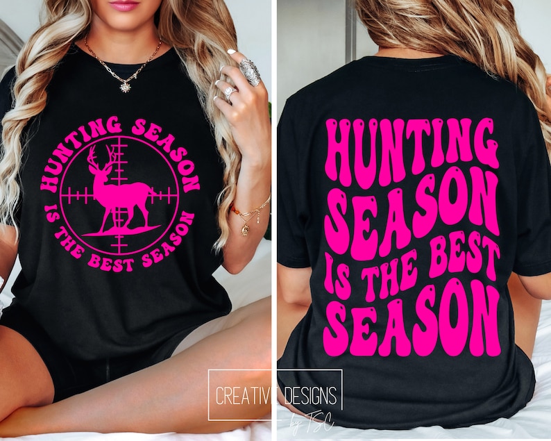 May include: Black t-shirt with the text "HUNTING SEASON IS THE BEST SEASON" in bright pink. The front of the shirt features a pink deer graphic inside a target reticle. The back of the shirt has the same text in a wavy font.