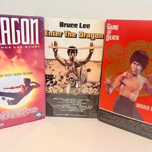 RARE VHS Bruce Lee - SEALED and Watermark of Enter the Dragon. Includes Game of Death, and Dragon (original plastic wrap). Perfect Condition