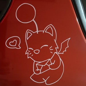 May include: White vinyl sticker of a cartoon cat with a heart-shaped speech bubble, a halo, and wings. The cat is smiling and holding its paws together.