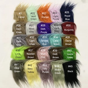 May include: A color chart of 45 different faux fur swatches, each labeled with a number and a color name. The swatches are arranged in five rows of nine swatches each.