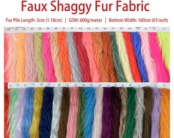 May include: A swatch card of faux shaggy fur fabric in various colors. The fabric has a pile length of 3 cm (1.18 inches) and a GSM of 600g/meter. The bottom width of the fabric is 160 cm (63 inches).
