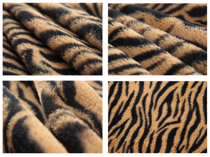 May include: Close-up of a brown and black faux fur fabric with a tiger stripe pattern.
