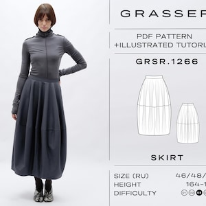 May include: A woman wearing a dark gray long-sleeved top and a matching full skirt. The skirt has a unique, rounded shape. The image also shows a PDF pattern with the text "GRASSER" and "SKIRT". The pattern includes size and difficulty information.
