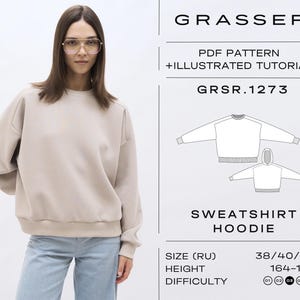 Peut inclure: Une femme porte un sweat-shirt beige et un jean bleu clair. L'image présente un patron de sweat à capuche, avec le texte "GRASSER PDF PATTERN + ILLUSTRATED TUTORIAL" et "SWEATSHIRT HOODIE". Le patron est de taille 38/40/42.