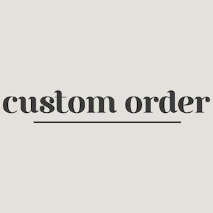 May include: The words "custom order" in a dark gray font are centered on a light beige background. A thin, horizontal line underlines the words. The text is in a serif font.