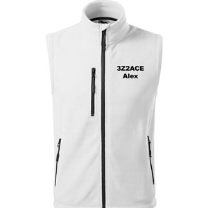 May include: White fleece vest with a black zip and two black zipped pockets. The vest has the text "3Z2ACE Alex" embroidered on the front.