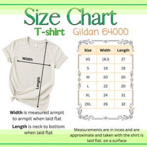 May include: A Gildan 64000 T-shirt size chart featuring a beige crew neck T-shirt with width and length measurement arrows. A table lists sizes XS through 2XL with corresponding width and length measurements in inches for a flat-laid garment.