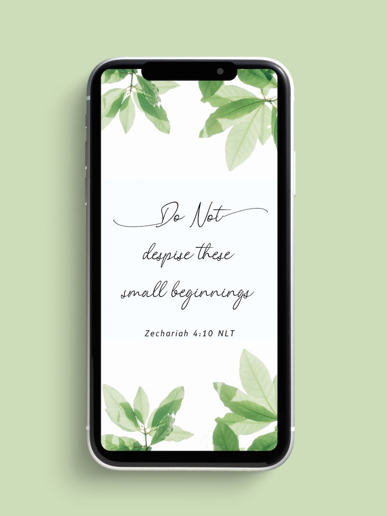 Peut inclure: Un &eacute;cran de t&eacute;l&eacute;phone avec un fond blanc et des feuilles vertes autour des bords. Le texte sur l'&eacute;cran est "Ne m&eacute;prisez pas ces petits commencements Zacharie 4:10 NLT".