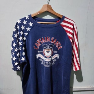 Vintage Captain Santa stars and straps shirt size XL blue