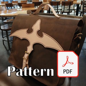 May include: A brown leather satchel with a light tan decorative accent in a stylized bird shape. The bag has a top handle and a shoulder strap. The word "Pattern" is printed in white at the bottom left, with a PDF icon on the right.
