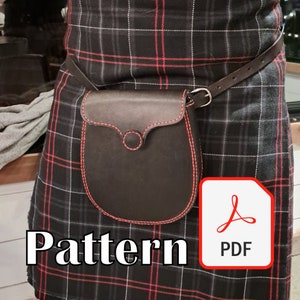 May include: A black leather kilt pouch with red stitching, worn on a black and red plaid kilt. The pouch has a flap with a button closure. The image includes the text "Pattern" and a PDF icon.