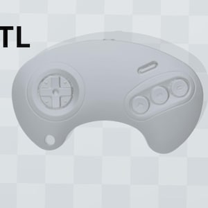 Può includere: Un controller Sega Genesis in plastica grigia con un pad direzionale, tre pulsanti e un pulsante di avvio.