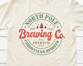North Pole Brewing Co. Shirt, Funny Christmas Retro Graphic Tee, XMAS North Pole Shirt, Unisex 100% Cotton Tee For Her & Him