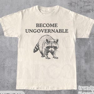 Camiseta "Conviértete en ingobernable", divertida camiseta con gráfico de mapache, camiseta de anarquía, camiseta de meme vintage, camiseta unisex, camiseta de panda de basura