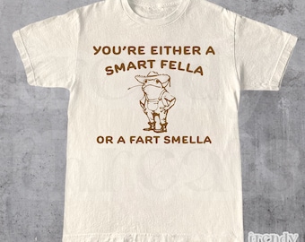 Are You A Smart Fella Or Fart Smella? • Retro Cartoon T Shirt • Weird T Shirt • Meme T Shirt • Cowboy Frog T Shirt • Unisex