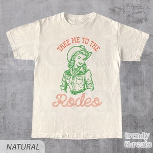 Beige Shirt With The quote: Take Me To The Rodeo