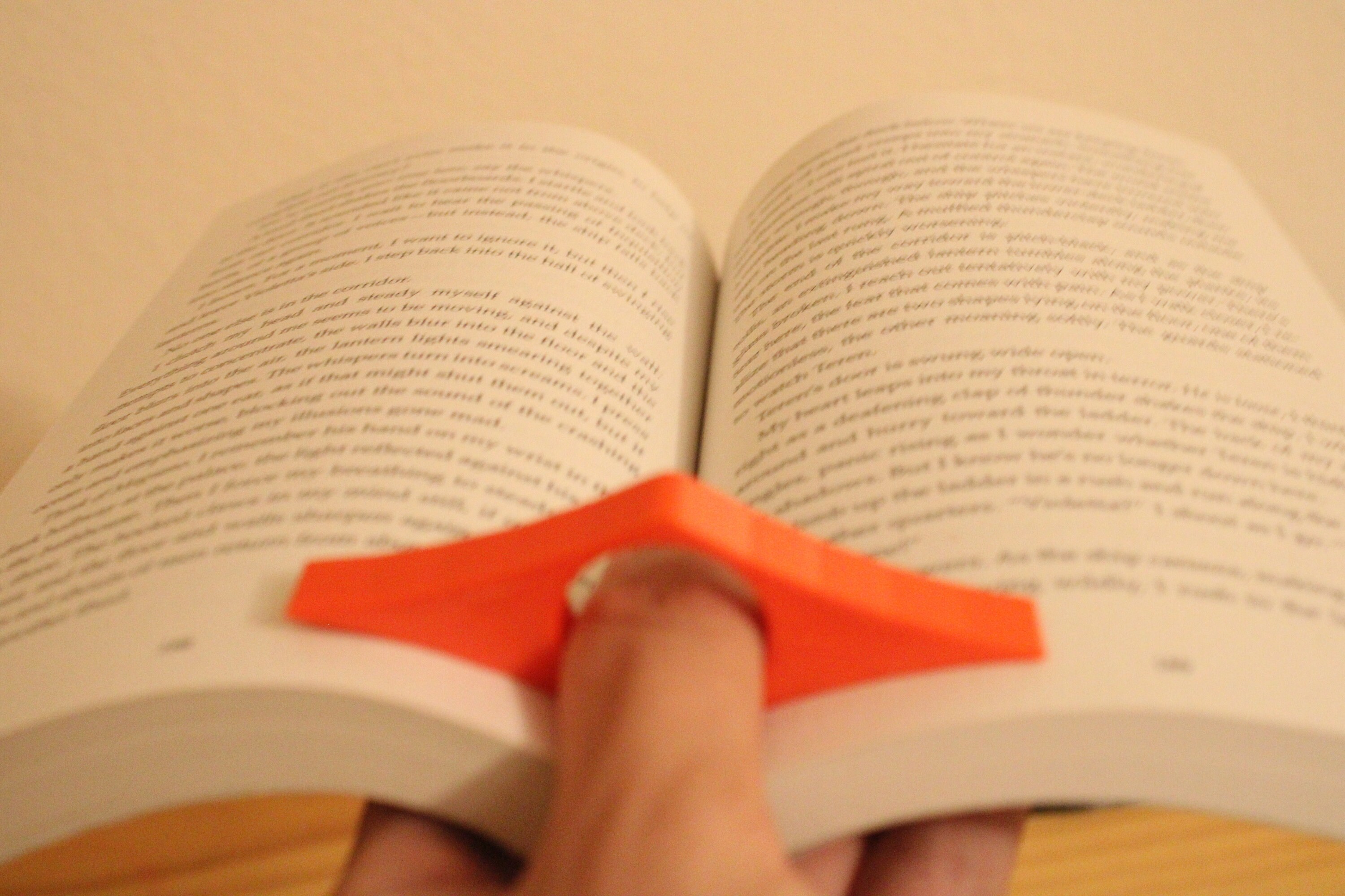 Bookmark holder, made from a disposed hardback novel with the pages folded  back into each other. The bookmarks …